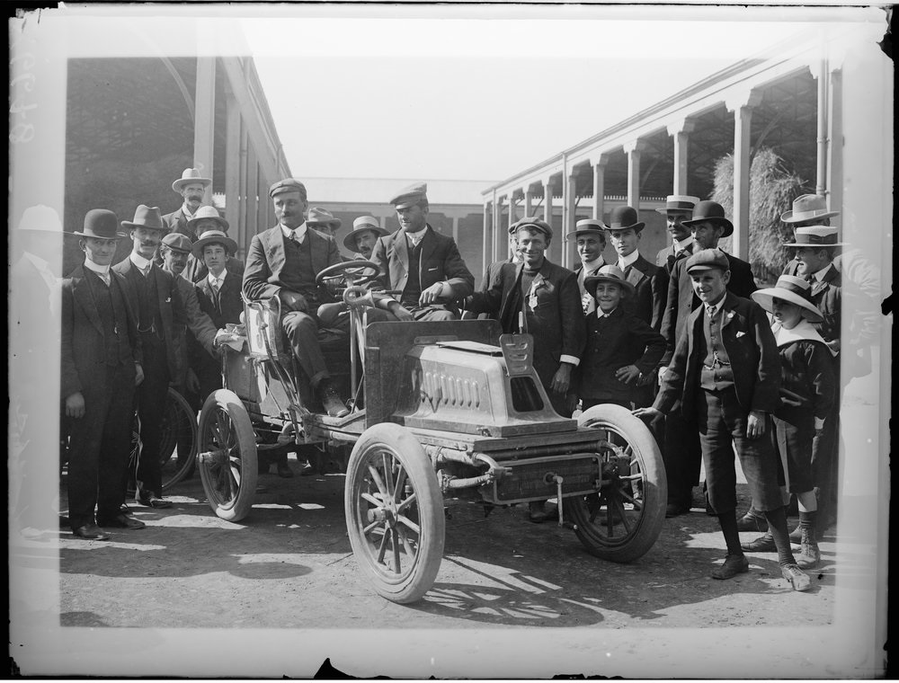 Group-of-men-standing-with-car-from-1905-Dunlop-Reliability-Trial-State-Library-of-Victoria.jpeg